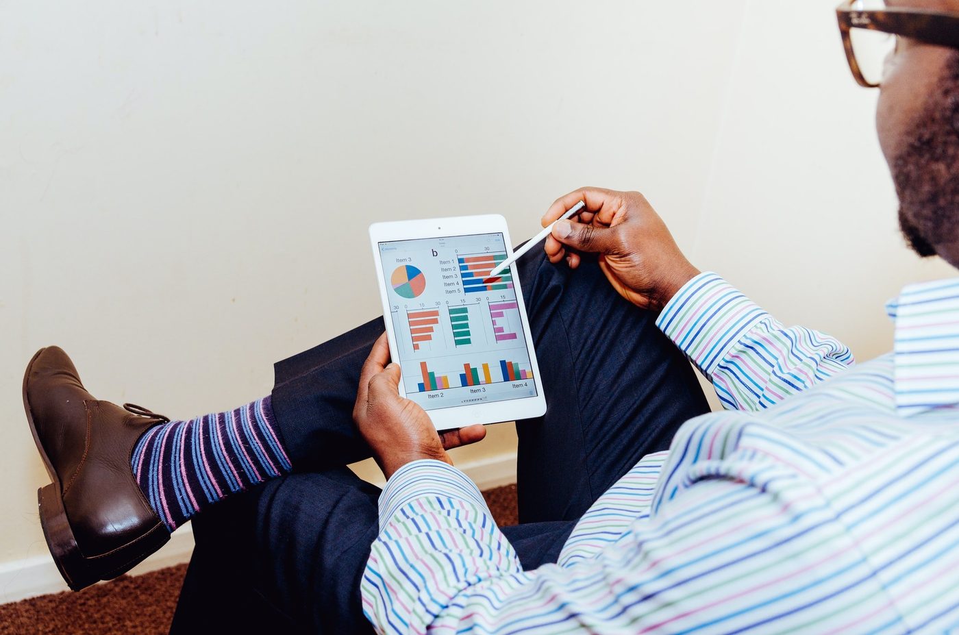 Man looking at financial charts